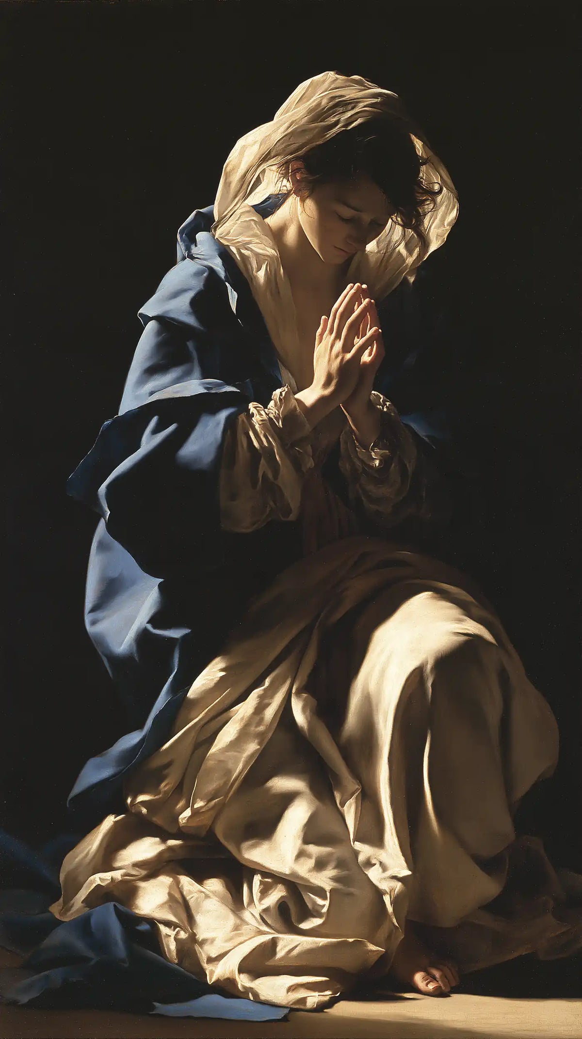 Virgin Mary in Prayer — Ivory and the Blue of Devotion
